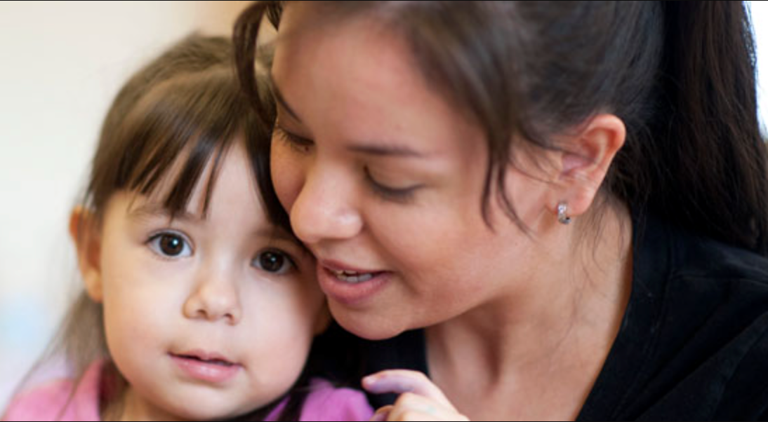 A child being cared for by her mother